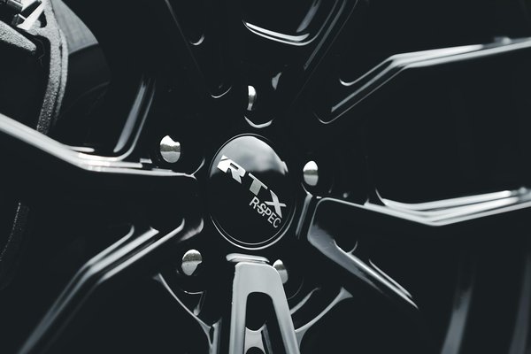 What are the benefits of retrofitting parking sensors on an older UK vehicle?